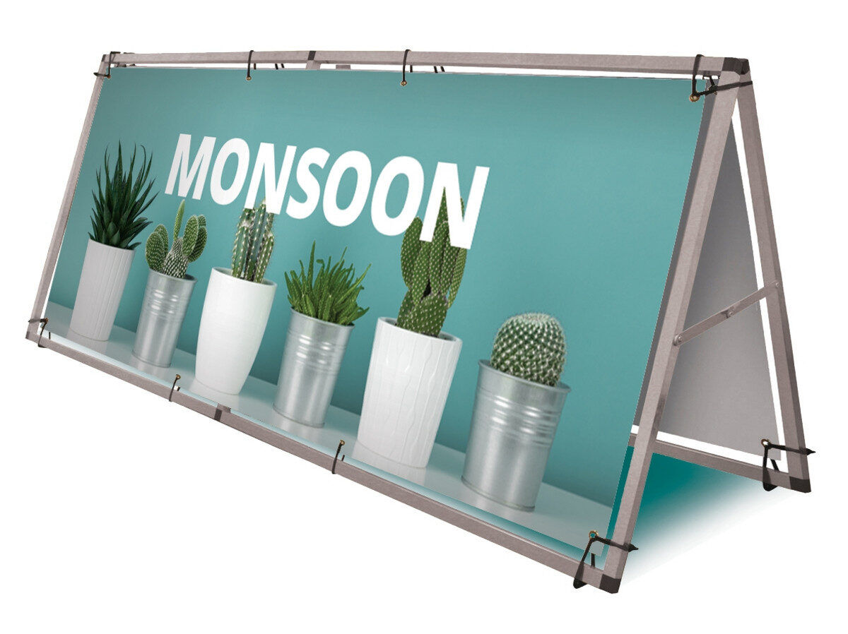 Outdoor banner stand frame holding a printed graphic